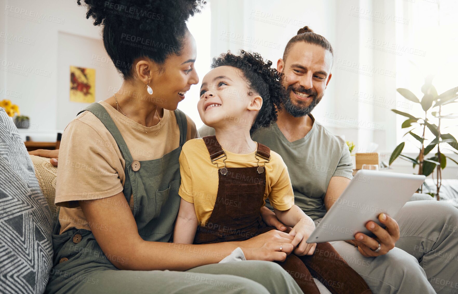 Buy stock photo Home, family and parents with a tablet, boy and connection with games, cartoon and relax. People, mother or father with their son, child or kid on a sofa, technology or social media with conversation