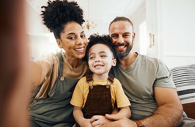 Buy stock photo Interracial parents, child and selfie on couch, smile and hug for love, bonding and memory on web blog. Mom, father and kid for photography, profile picture and happy for social media in family home