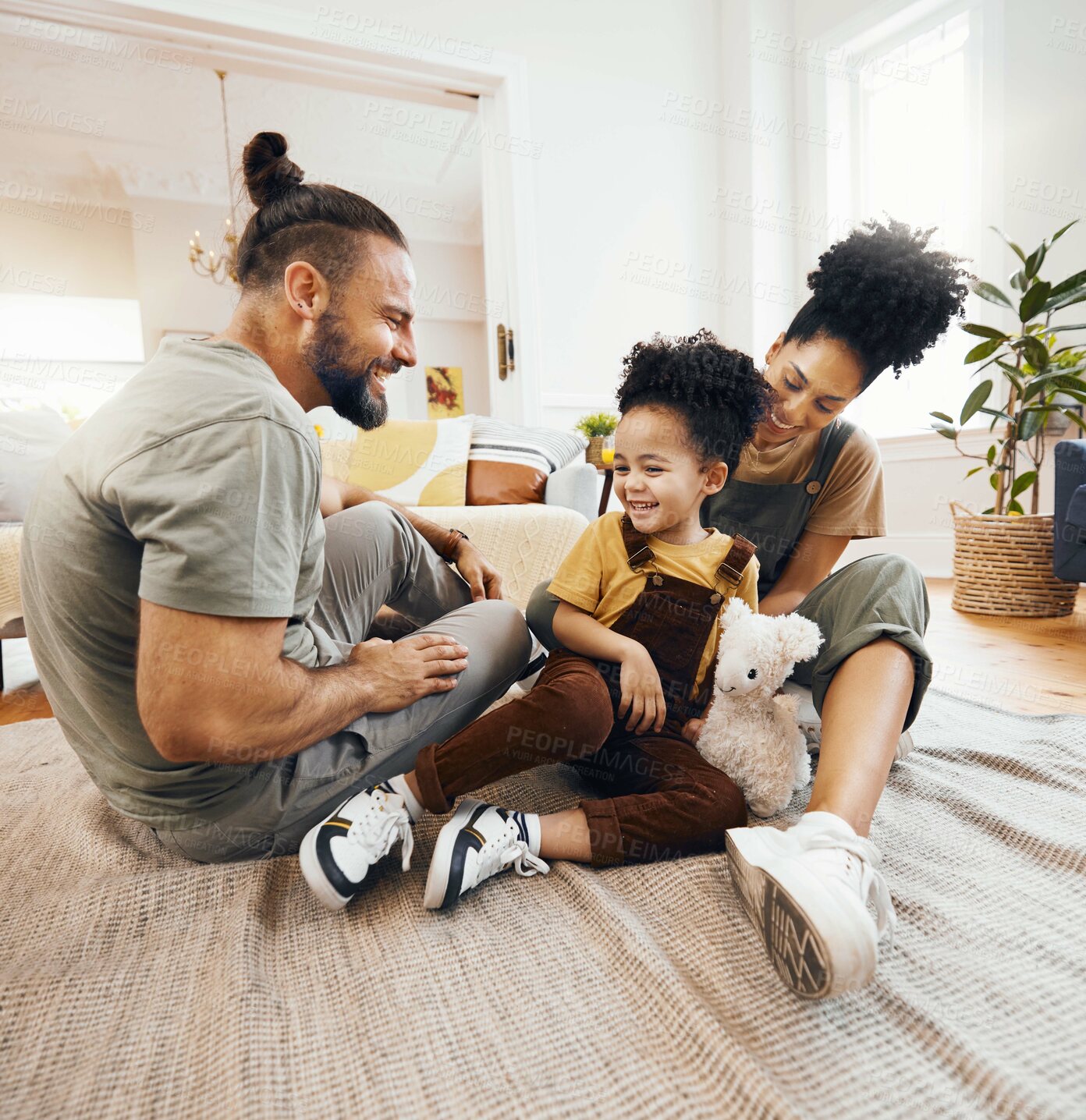 Buy stock photo Smile, love and an interracial family on the floor, playing in the living room of a home together for bonding. Mother, father and son on a carpet to relax with a game while looking happy in a house