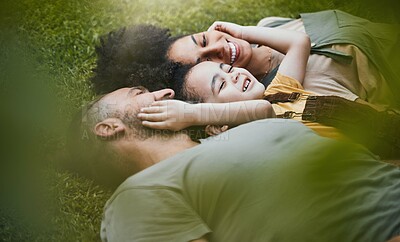 Buy stock photo Care, happy and a family lying on the grass in nature for bonding, laughing and comfort. Love, smile and an interracial, father, mother and boy kid in a garden or backyard with an embrace together