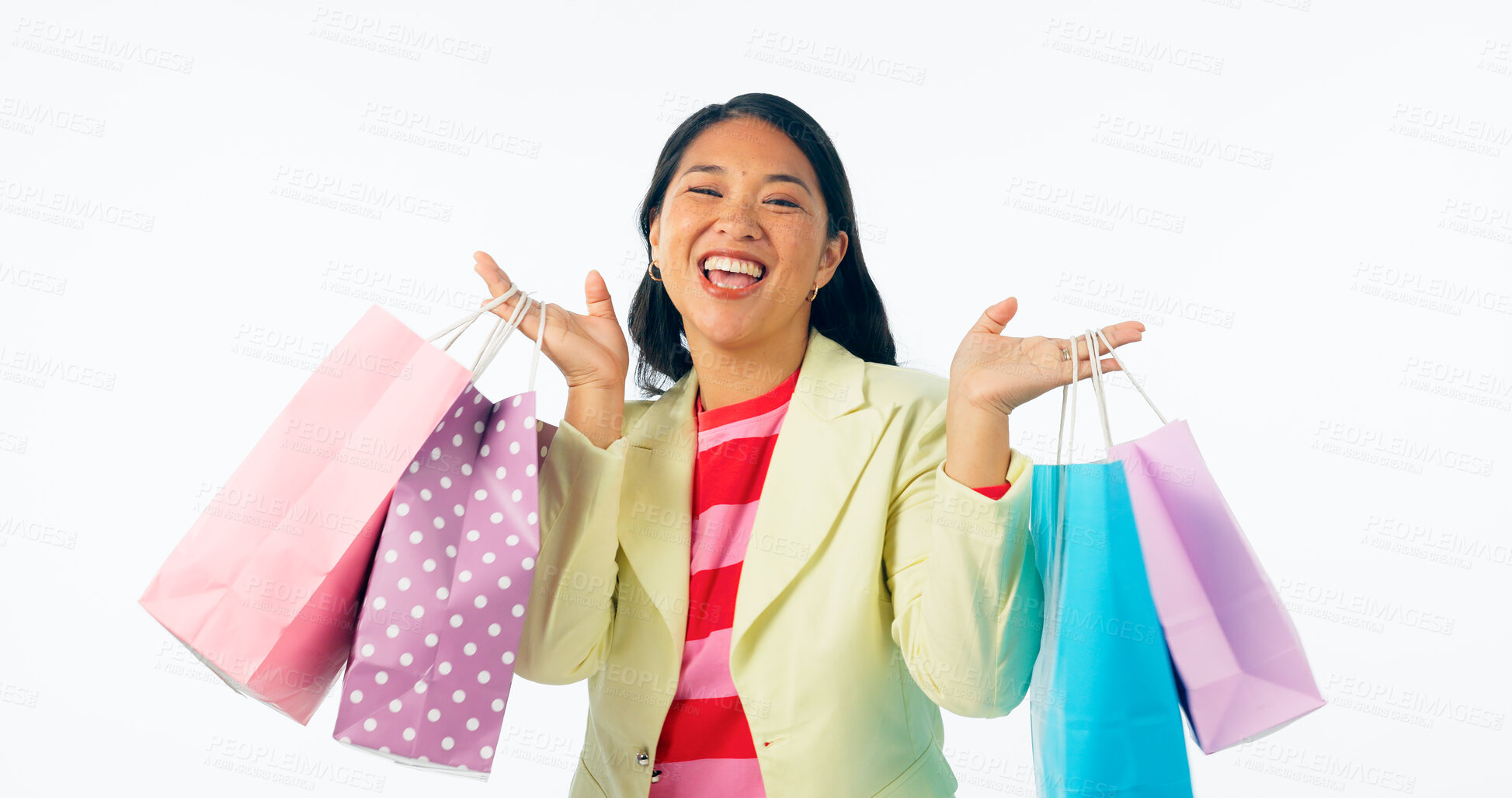 Buy stock photo Woman, winner and shopping bag for discount, sale and retail giveaway or competition isolated on a white background. Portrait of an excited asian customer with gift, winning or celebration in studio