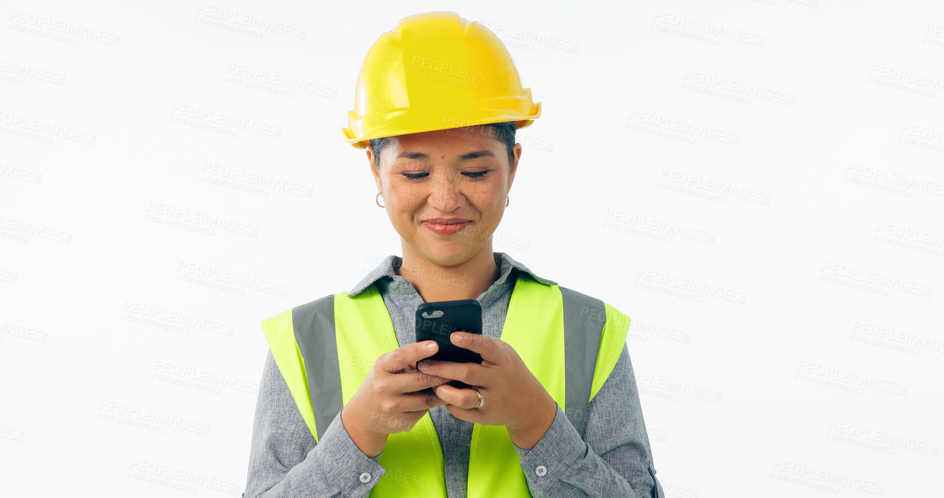 Buy stock photo Engineering, woman and phone for construction chat, communication and project management in studio. Asian contractor or builder typing on mobile for architecture design update on a white background