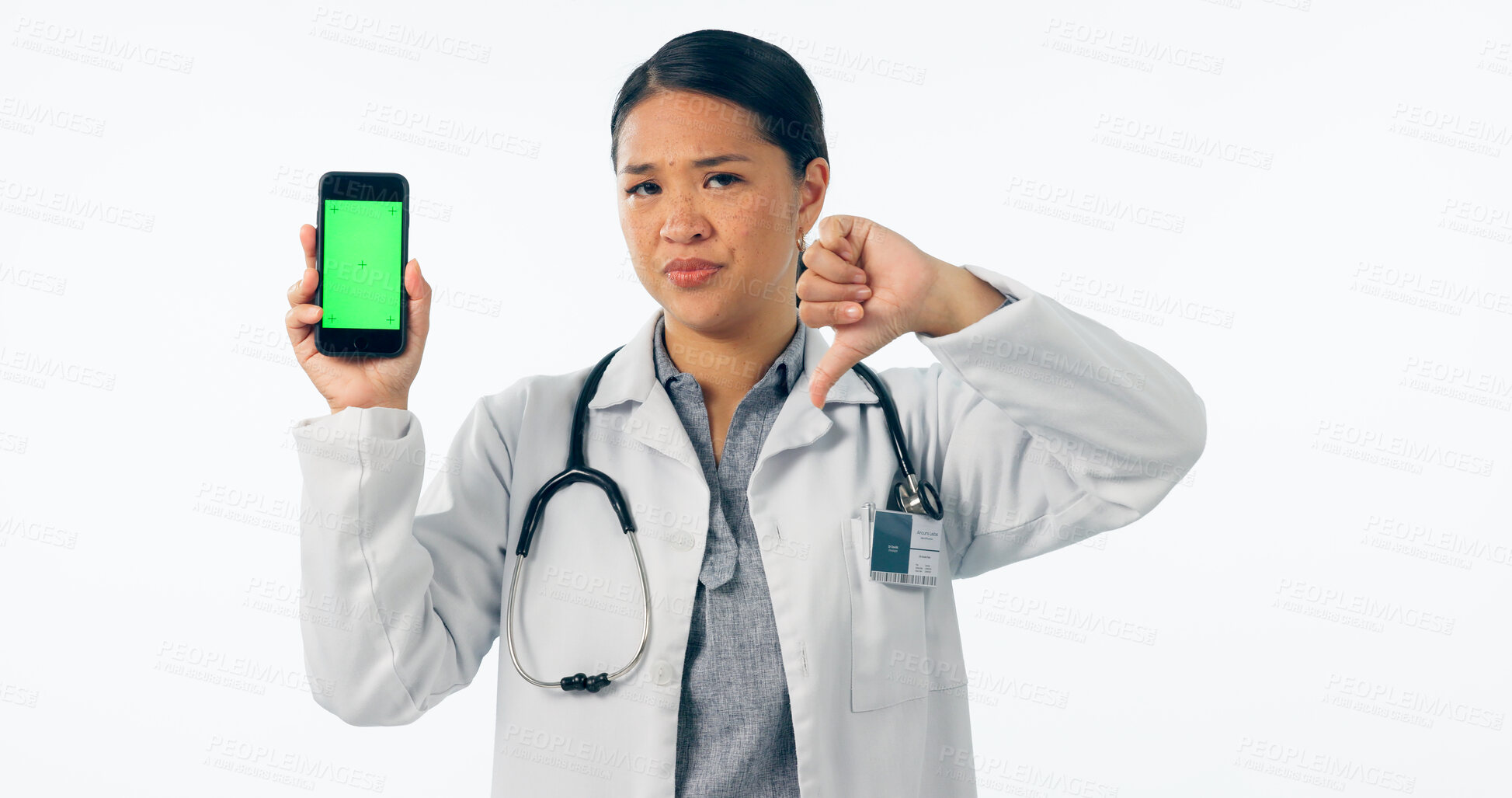 Buy stock photo Doctor, thumbs down and phone green screen for healthcare mistake, bad results and nope mockup in studio. Portrait of medical woman with mobile and wrong, fail or dislike isolated on white background