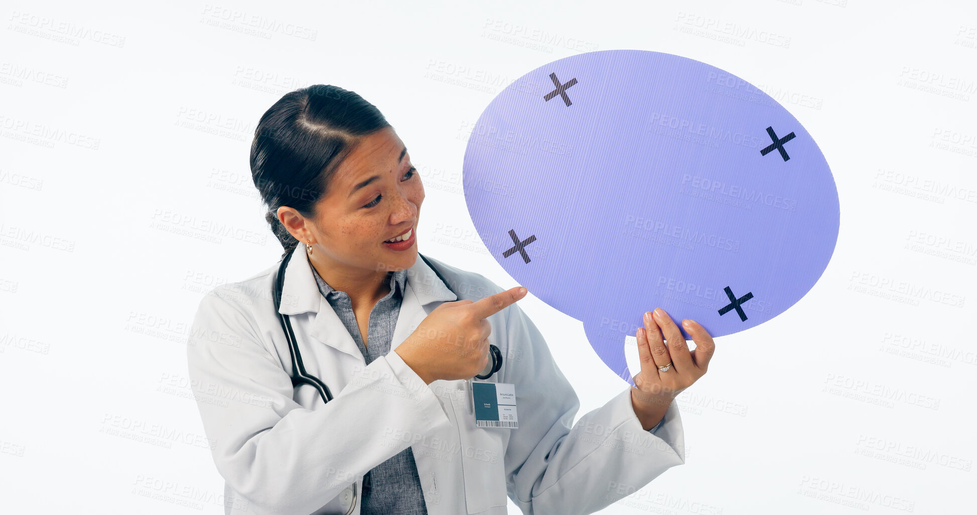 Buy stock photo Doctor, speech bubble and poster, presentation or chat mockup for healthcare translation or language forum in studio. Asian woman pointing to quote, advice or medical FAQ isolated on white background