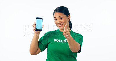 Buy stock photo Woman, volunteering and phone screen, presentation mockup and support, join us or marketing in studio. Portrait of asian student on mobile app, pointing you for NGO help isolated on white background