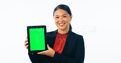 Buy stock photo Portrait of business woman, green screen and tablet for advertising space, offer and mockup newsletter in studio. Happy asian worker show digital announcement, launch or promotion on white background