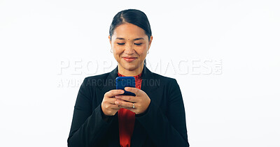 Buy stock photo Asian lawyer woman, smartphone and studio with smile, reading or texting client with ideas by white background. Japanese advocate, attorney or corporate legal expert with phone, typing and networking