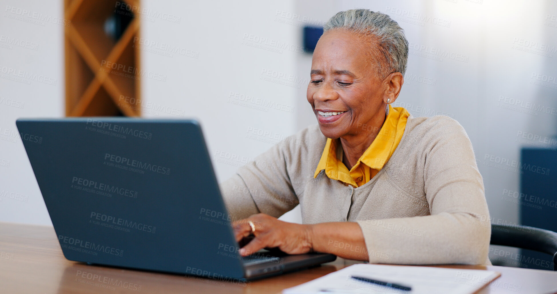 Buy stock photo Happy senior woman, laptop and typing in finance with documents for bills or expenses in remote work at home. Mature African female person or freelancer smile on computer in financial budget at house