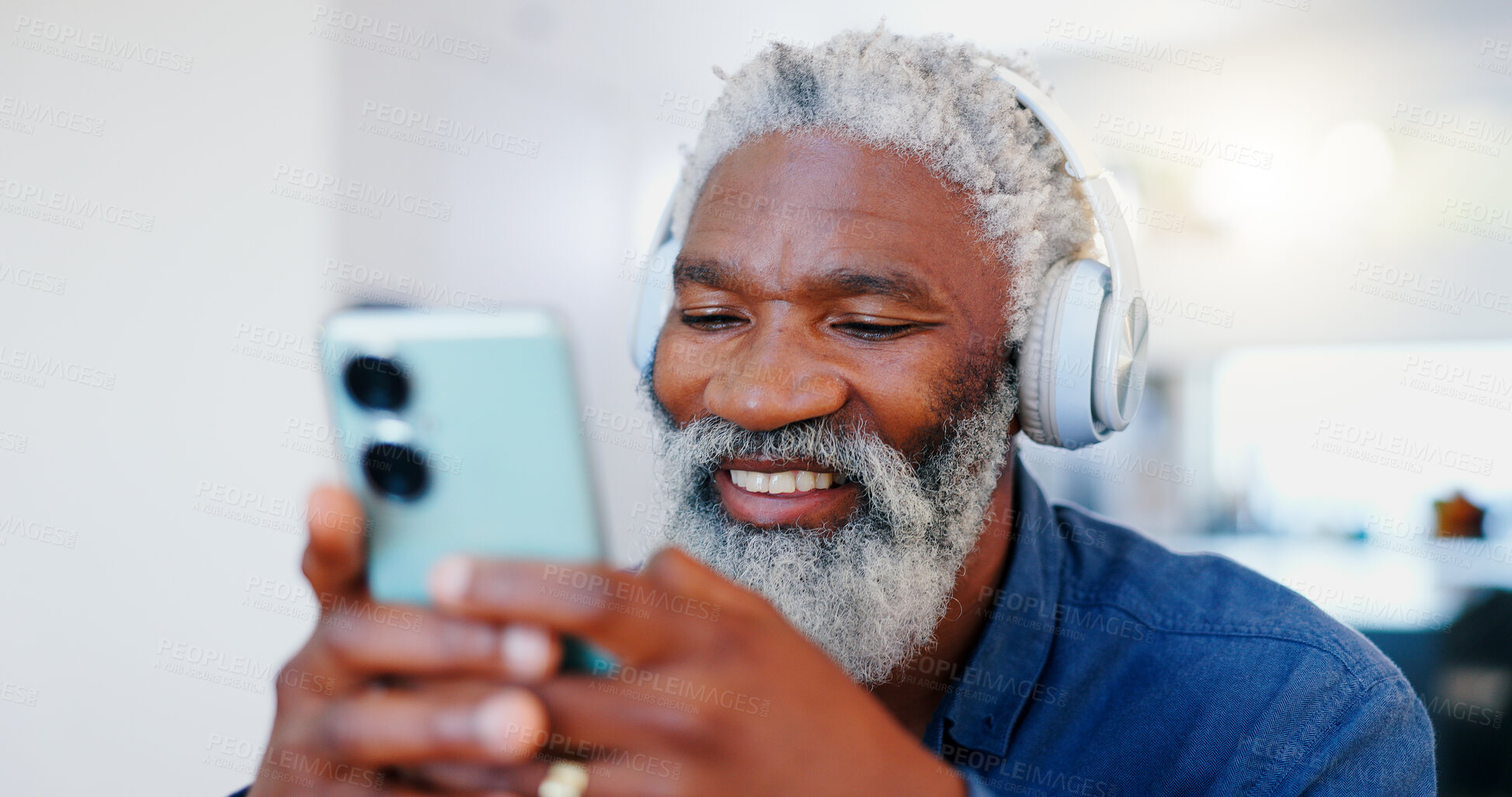 Buy stock photo Senior black man, headphones and phone in music or audio streaming, communication or networking at home. Face of mature and happy African male person with smile listening on mobile smartphone headset