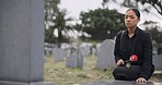 Sad woman, graveyard and rose on tombstone in mourning, loss or grief at funeral or cemetery. Female person with flower in depression, death or goodbye at memorial or burial service for loved one