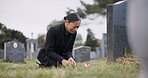 Sad woman, graveyard and crying with rose by tombstone in mourning, loss or grief at funeral or cemetery. Female person with flower in depression, death or goodbye at memorial or burial service