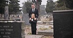 Child, death or father in graveyard for funeral. spiritual service or burial for respect in Christian religion. Rose, depressed or sad kid in cemetery for grief, loss or mourning with dad for support