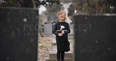 Buy stock photo Sad, death or kid in cemetery for funeral. spiritual service or grave visit for respect in Christian religion. Mourning, tomb or depressed girl child outside in graveyard for grief, loss or farewell