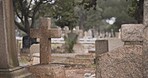 Funeral, cemetery and cross on tombstone for death ceremony, religion or memorial service. Catholic symbol, background or Christian sign on gravestone for mourning, burial or loss in public graveyard