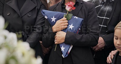 Buy stock photo Funeral, graveyard and woman with American flag for veteran for respect, ceremony and memorial service. Family, depression and sad people with flower in cemetery for military, army and soldier hero