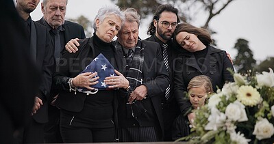 Buy stock photo Funeral, cemetery and family with American flag for soldier for respect, ceremony and memorial service. Sad, depression and people by coffin in graveyard mourning military, army and veteran hero