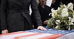 USA veteran funeral, woman and casket with touch, sad family and flag for mourning, depression and respect. Widow, people and army service with coffin, burial or memorial for war hero in Philadelphia