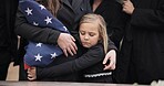 Sad, hug and a child at a funeral or graveyard for a ceremony or death with family. Depression, young and a girl kid with a person for comfort at a cemetery for mourning, grief together or loss