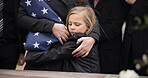 Sad, hug and a child at a funeral or graveyard for a ceremony or death with family. Depression, young and a girl kid with a person for comfort at a cemetery for mourning, grief together or loss