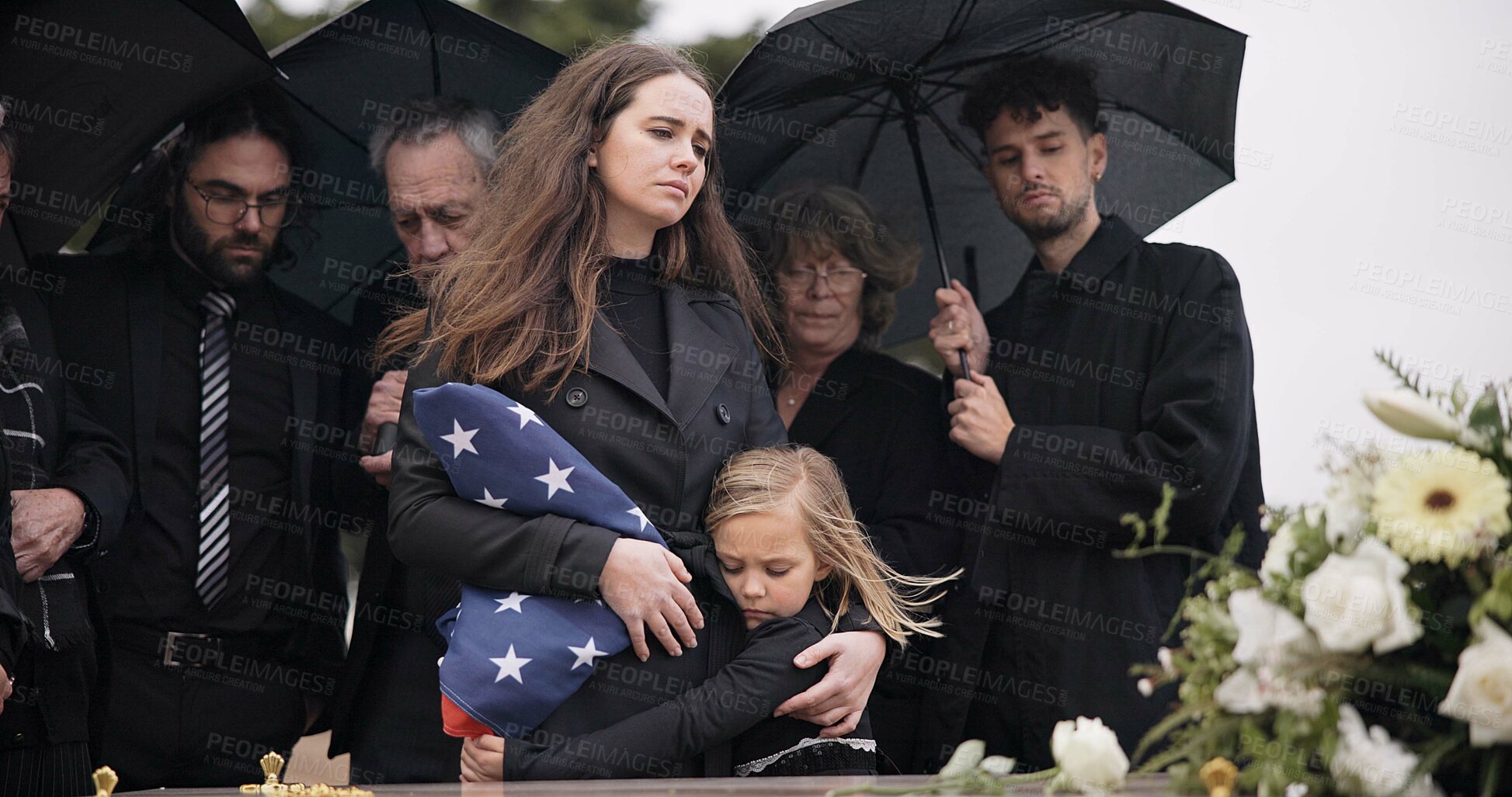 Buy stock photo Funeral, family and sad people with American flag, grief and mourning death, burial and widow depressed at farewell event. Kid, mother and group gathering at coffin, casket and crying at ceremony