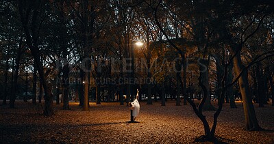 Ballerina, dancing and night in outdoor dark at street light for performance, practice or creative artist. Female person, leg and dress on pointe in Japanese garden for talent, entertainment or skill