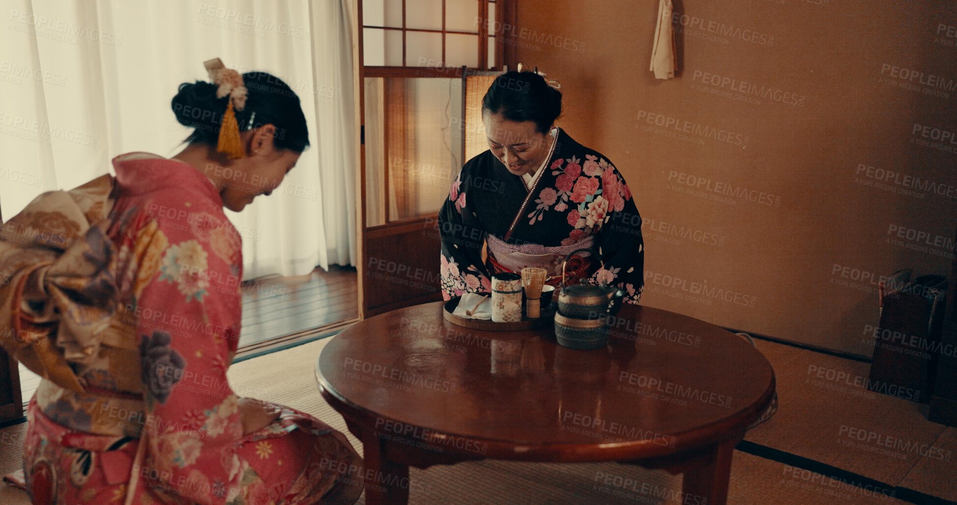 Buy stock photo Culture, home and Japanese women with tea, leaves and herbs in traditional tearoom. Friends, ceremony and people bow with herbal beverage for wellness, mindfulness and detox for drinking ritual