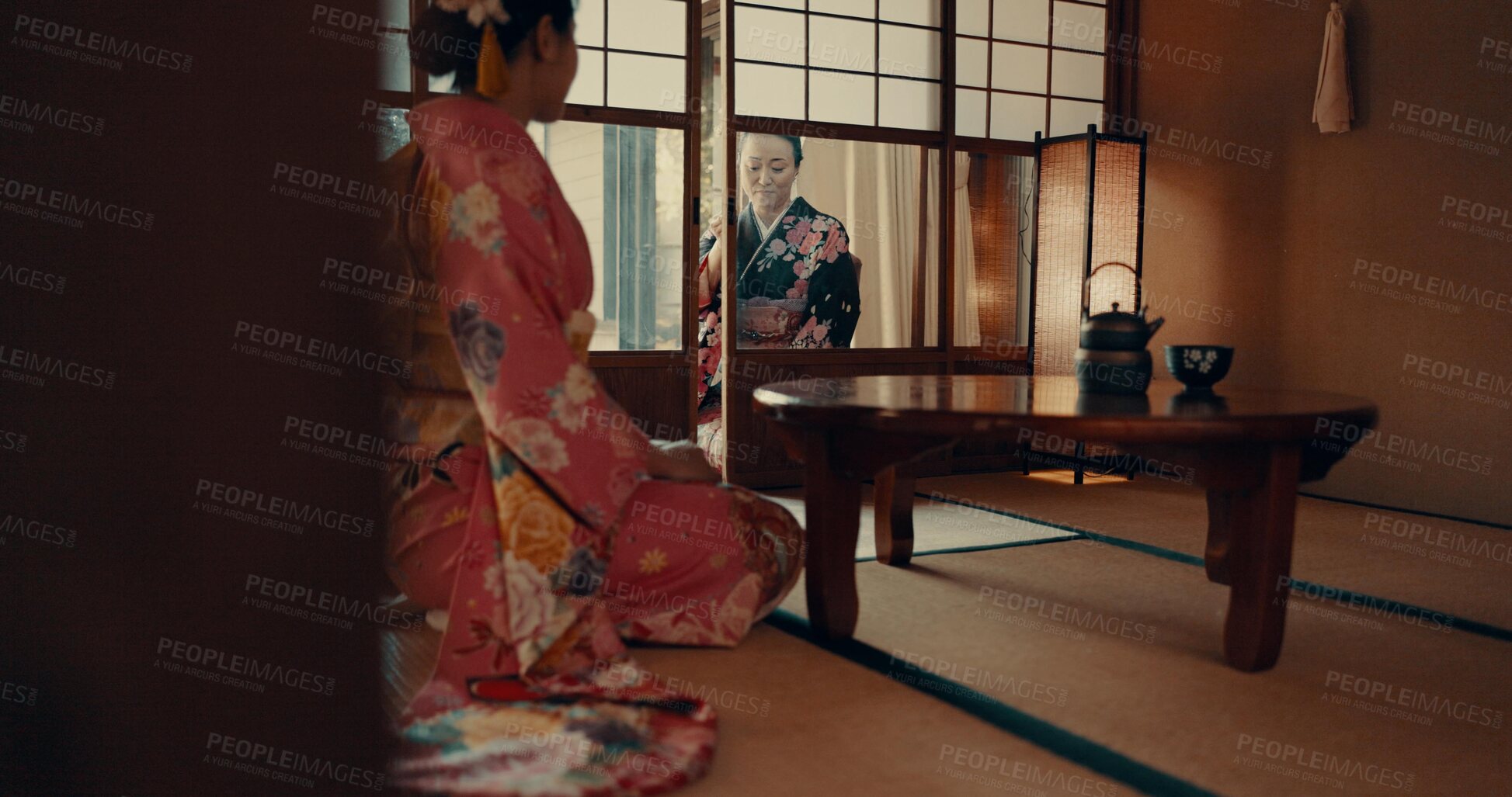 Buy stock photo Japanese, women and kimono in corridor for ceremony in chashitsu room with indigenous fashion or clothing. People, ritual and culture for temae, wellness and zen in architecture building in Tokyo