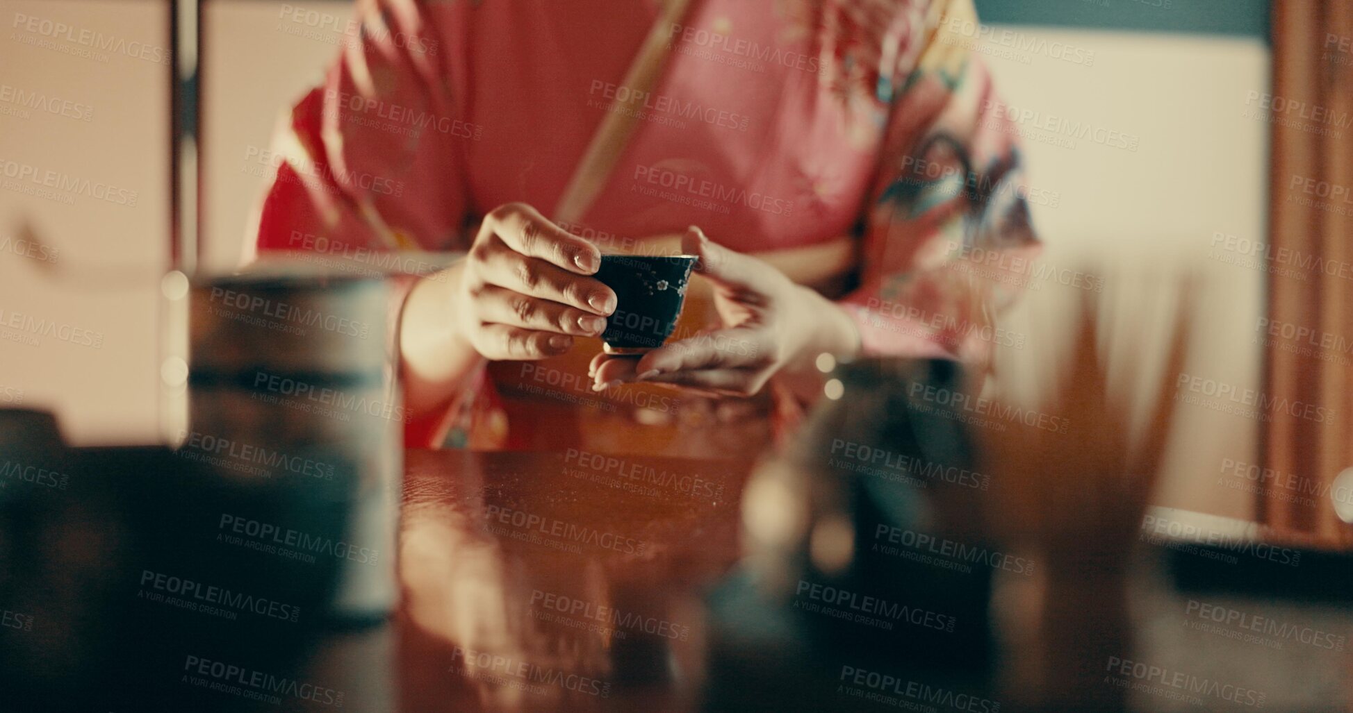 Buy stock photo Hands of woman in traditional Japanese tea house, kimono and relax with mindfulness, respect and service. Girl at calm tearoom with matcha drink in cup, zen culture and ritual at table for ceremony.