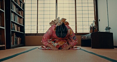 Woman, prayer and Japanese or spiritual religion in tatami room for tradition culture, respect or ritual. Asian person, kneel and kimono practice or mindfulness healing or god worship, holy or zen