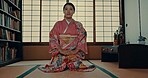 Japanese woman, face and kimono for ceremony in Chashitsu room and sitting on the floor. Traditional, fashion or girl with pride, respect and honor for culture, heritage and waiting for matcha or tea