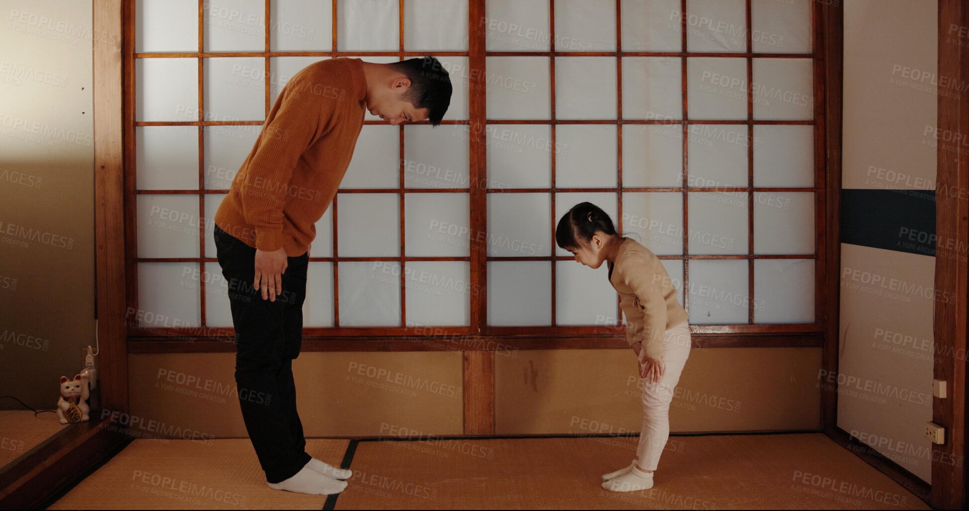 Buy stock photo Traditional, home and Japanese father and child bow for greeting ceremony, ritual and respect. Family, culture and dad with young girl in indigenous house for bonding, relationship and love together