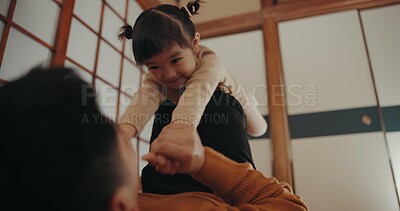 Buy stock photo Father, home and play with daughter, happy and smile for joy, japanese and childhood memories. Dad, girl and fun with child, living room floor and parenting together with love, carefree and caring
