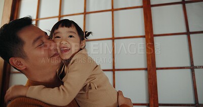 Buy stock photo Dad, home and hug with daughter, happy and smile for joy, japanese and childhood memories. Father, girl and fun with child, living room floor and parenting together for joy, carefree and joyful
