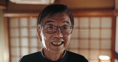 Happy, portrait and senior Japanese man at his home with positive, good and confident attitude. Smile, glasses and face of elderly male person in retirement with pride in modern house in Tokyo Japan.