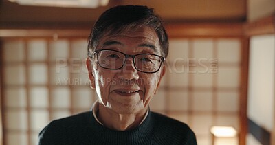 Buy stock photo Smile, portrait and senior Japanese man at his home with positive, good and confident attitude. Happy, glasses and face of elderly male person in retirement with pride in modern house in Tokyo Japan.