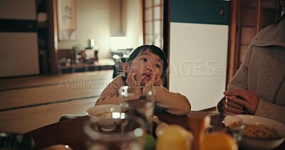 Buy stock photo Asian child, family home and bored at dinner with parents for food, tired or night in dining room. Japanese kid, nutrition and diet with thinking, annoyed or frustrated by table at apartment in Tokyo