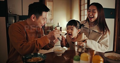 Buy stock photo Family, eating and dinner with girl, parents and Japanese with joy, meal and home with happiness. Mother, apartment and father with kid, food and bonding together with nutrition, smile and love