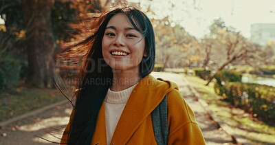 Japanese, portrait and woman with smile in park for travel on vacation, adventure and explore path with trees. Gen z, student and happy walk on holiday in nature, forest and trail in Kyoto woods