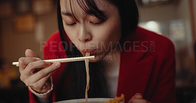Woman, ramen and eating noodles in restaurant for nutrition, healthy meal and diet. Hungry lady, chopsticks and spaghetti for lunch, dinner and Japanese cuisine in cafeteria, diner and fast food menu