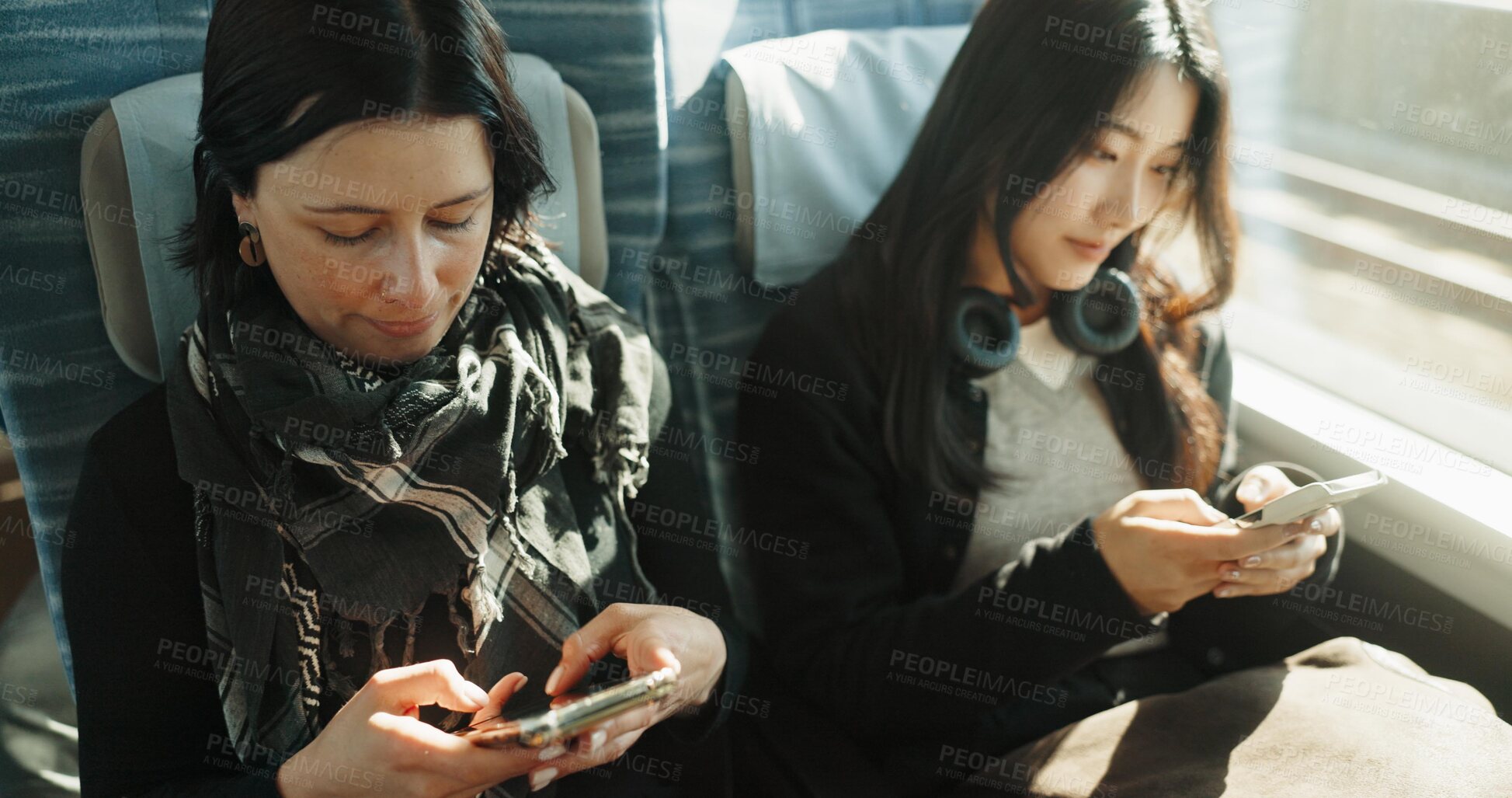 Buy stock photo Women, travel and train with smartphone on social media and public transport on metro bullet in japan. Friends, cellphone or diversity on fast vehicle on weekend trip or commute in tokyo on adventure