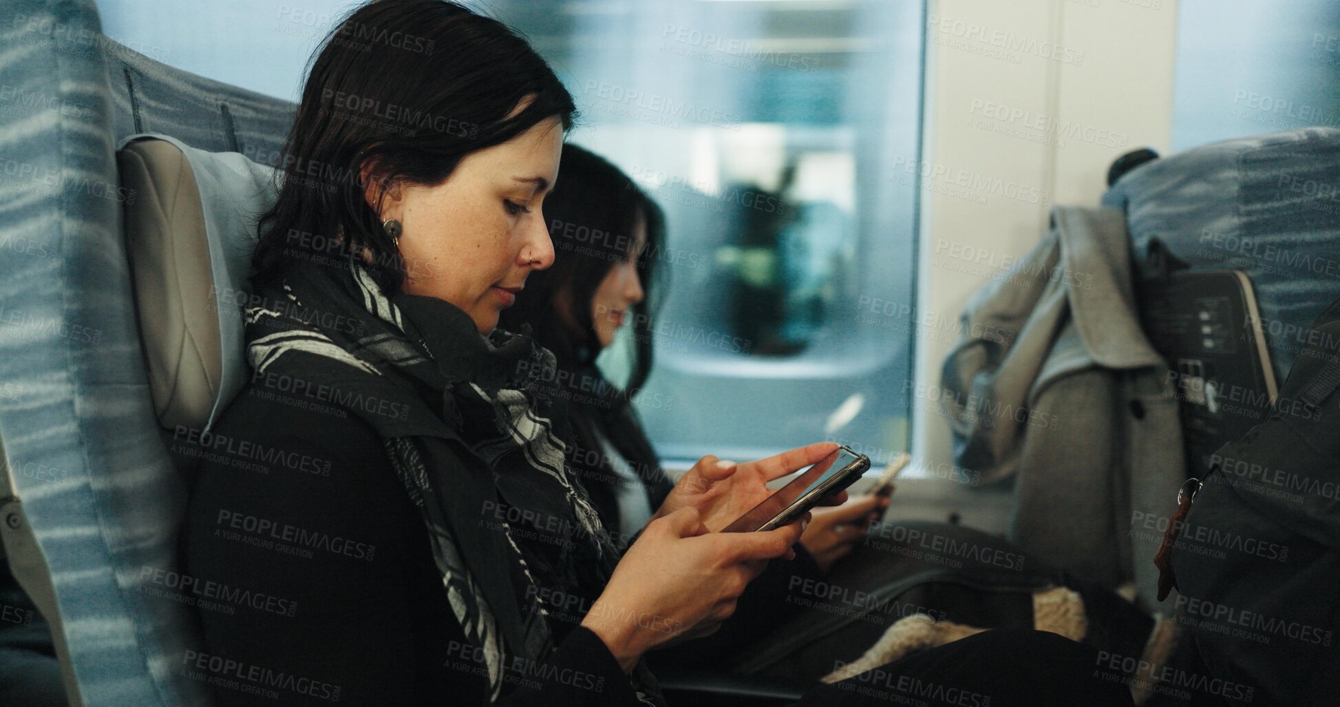 Buy stock photo Women, reading and train by smartphone on social media and public transport on metro bullet in japan. Friends, cellphone or diversity on fast vehicle on weekend trip or commute in tokyo on adventure