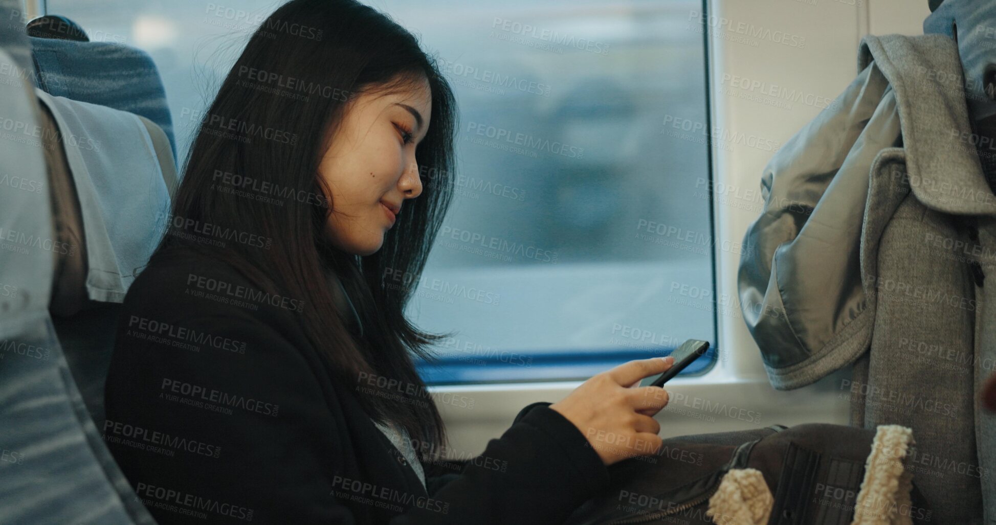 Buy stock photo Japanese woman, travel and train on cellphone, social media and public transportation on metro bullet. Person, smartphone and reading on fast vehicle on weekend trip and commute in tokyo on adventure