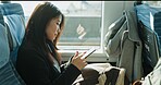 Japanese woman, reading and smartphone on train, social media and public transportation on metro bullet. Person, cellphone and online on fast vehicle on weekend trip and commute in tokyo on adventure