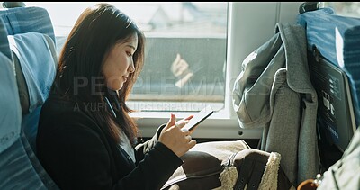 Buy stock photo Japanese woman, reading and smartphone on train, social media and public transportation on metro bullet. Person, cellphone and online on fast vehicle on weekend trip and commute in tokyo on adventure