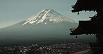 Chureito Pagoda, Mount Fuji and city in morning with temple, trees and blue sky on travel. Japanese architecture, culture and spiritual history with view of mountain, snow and calm Asian landscape.