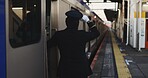 Train, platform and conductor at station for travel, commute and journey on railway transportation. Public transport, underground railroad service and back of man for departure, arrival and subway