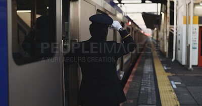 Train, platform and conductor at station for travel, commute and journey on railway transportation. Public transport, underground railroad service and back of man for departure, arrival and subway