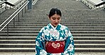 Japanese woman, beauty and kimono by stairs, urban city and culture by heritage celebration. Young person, religion and traditional clothes in tokyo town with peace, respect and indigenous fashion