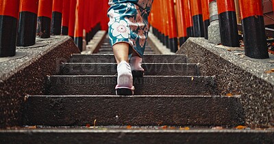 Buy stock photo Woman, shinto culture or walk by stairs in japan, spiritual path or indigenous religion in kimono. Person, traditional clothes or worship in peace, respect or back by Fushimi Inari Taisha in kyoto