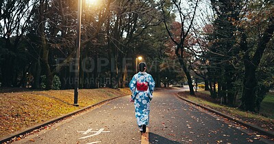 Buy stock photo Back, woman in street and Japanese clothes, travel and nature with journey through town in Kyoto. Walking outdoor, road with traditional fashion, kimono or dress, adventure and local trip on path